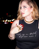 Model wearing the black Life’s a Bitch tank in a nighttime close-up.