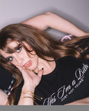 Close-up of a model wearing the black Yes I’m a Bitch — Just Not Yours cropped tee.