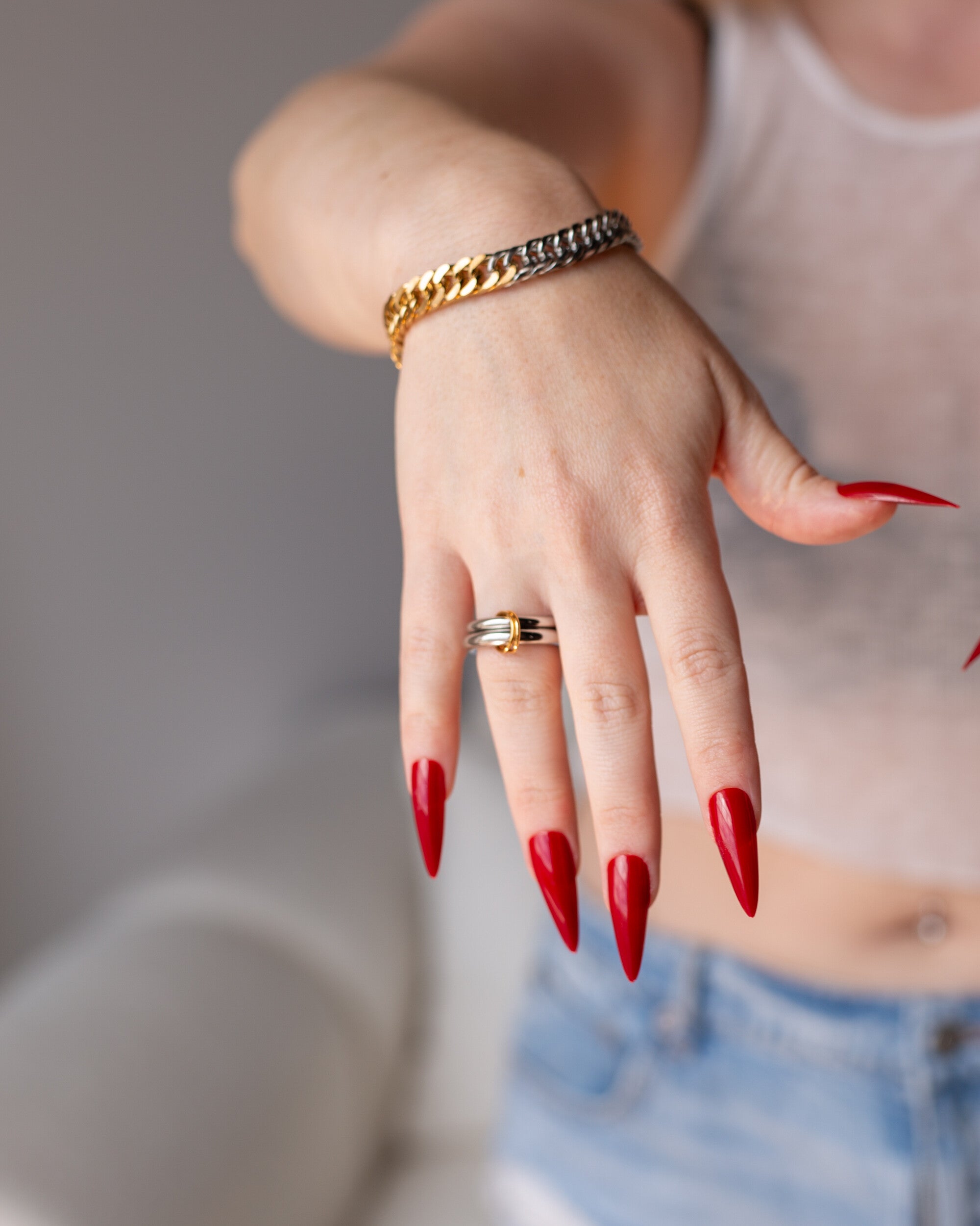 Ara Bracelet, a mixed-metal 18K Gold PVD clasp bracelet.