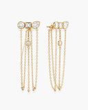 Pair of gold-tone Ariadne earrings with mixed-shape clear stones and cascading chain tassels.