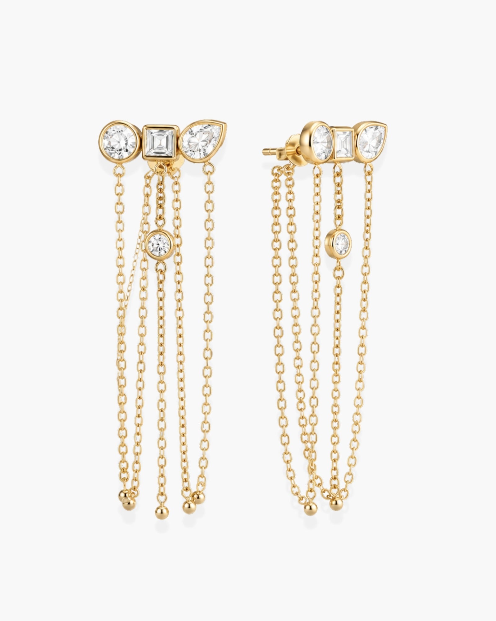 Pair of gold-tone Ariadne earrings with mixed-shape clear stones and cascading chain tassels.