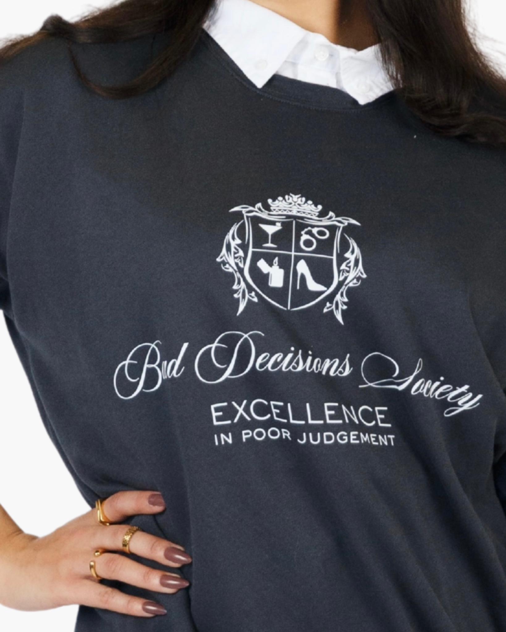Black crewneck sweatshirt with a Bad Decisions Society crest and white lettering.