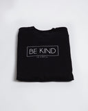 Folded black Be Kind of a Bitch crewneck sweatshirt with the chest design visible.