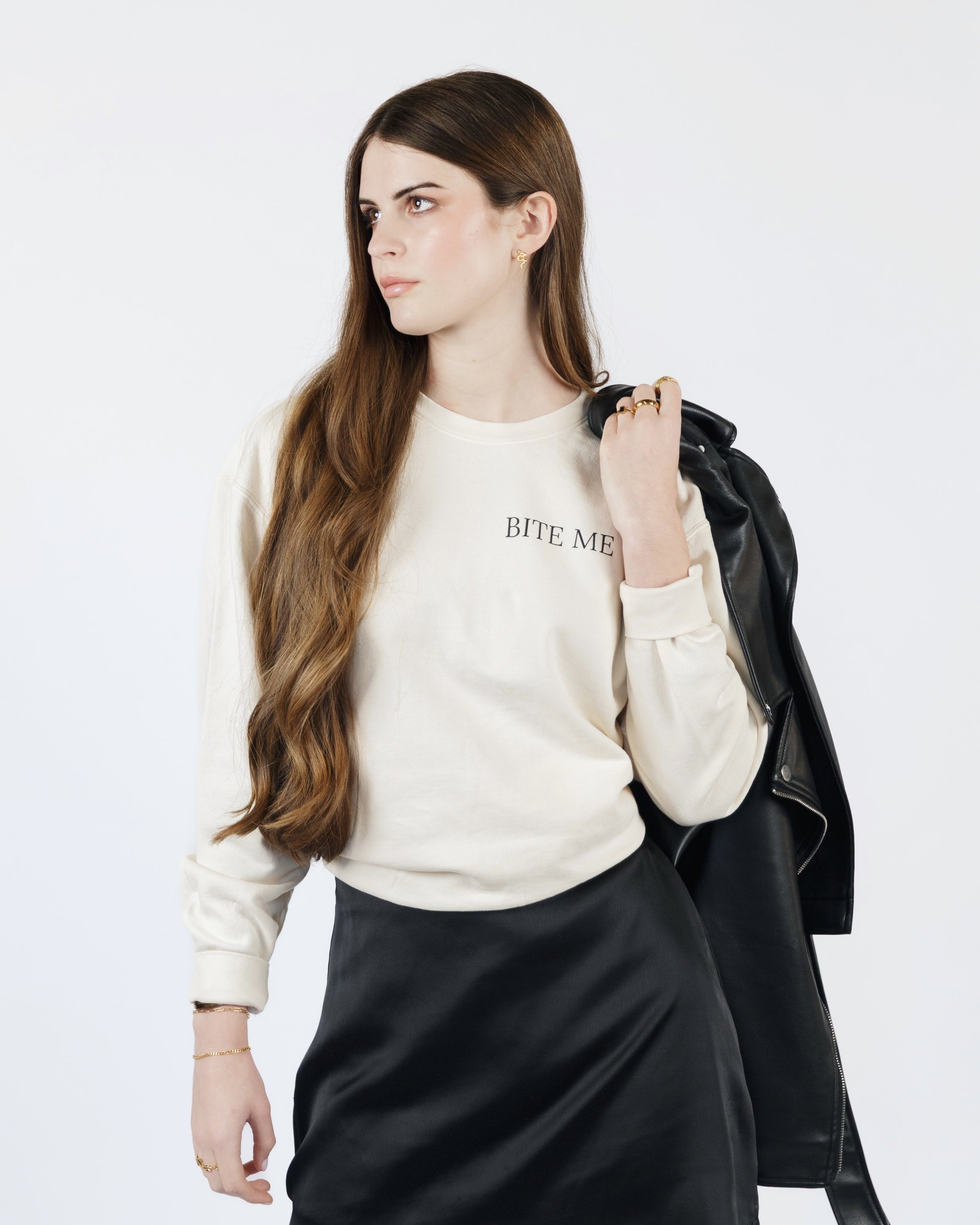 Supporting image of the cream Bite Me crewneck sweatshirt.