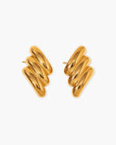 Pair of polished gold-tone statement studs with three layered elongated ridges.
