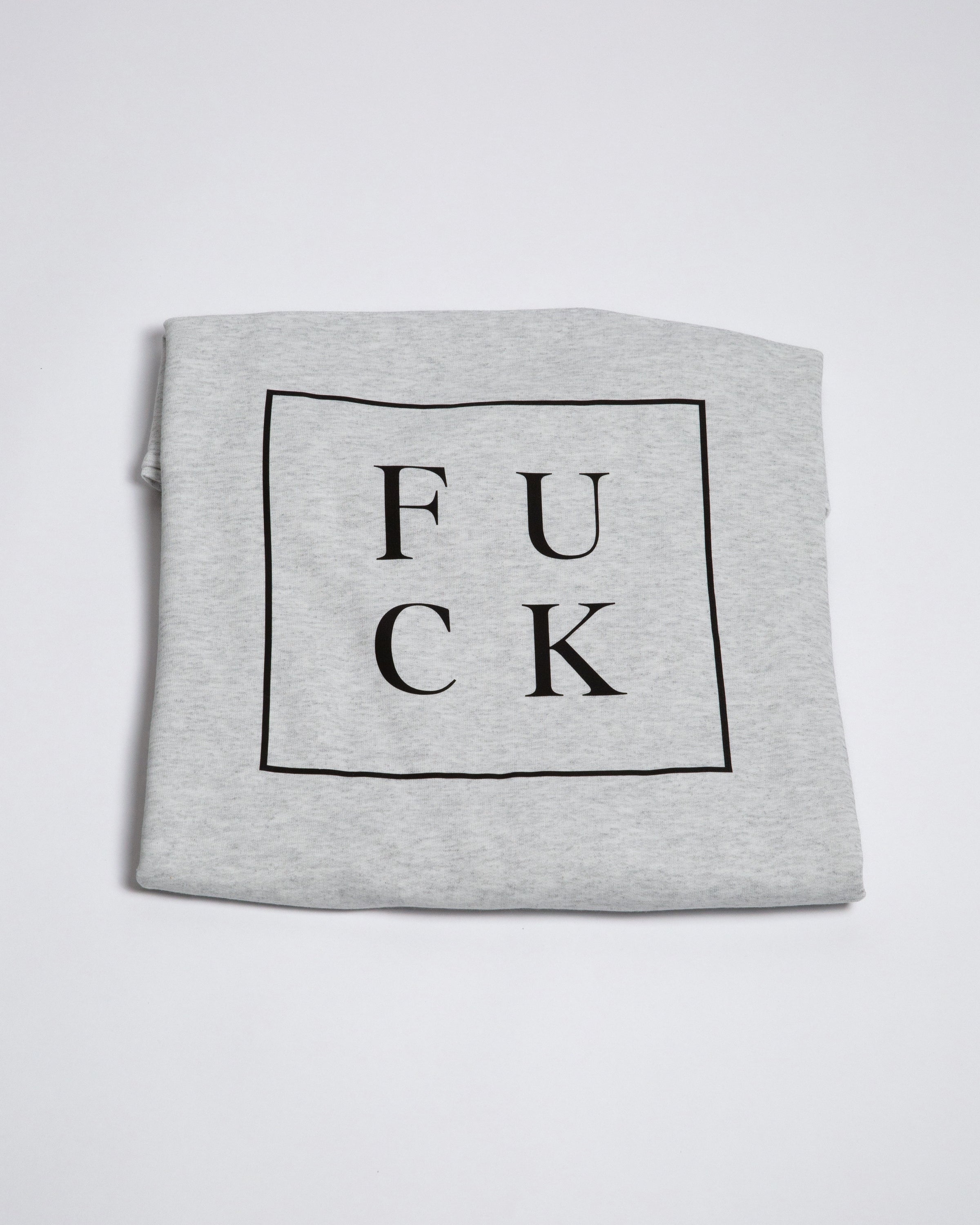 Heather-gray crewneck showing the boxed F U C K back graphic.