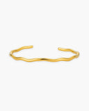 Calypso Cuff, a fluid wave-shaped 18K Gold PVD open cuff bracelet.