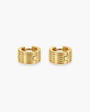 Pair of wide gold-tone huggie hoop earrings with stacked horizontal ridges.