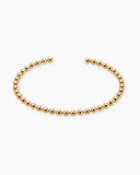 Daphne Cuff, a beaded textured 18K Gold PVD open cuff bracelet.
