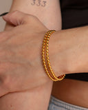 Daphne Cuff worn on the wrist, hover view.