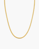 Slim gold-tone Demi flat mesh chain necklace with a smooth finish, lobster clasp and adjustable extender.