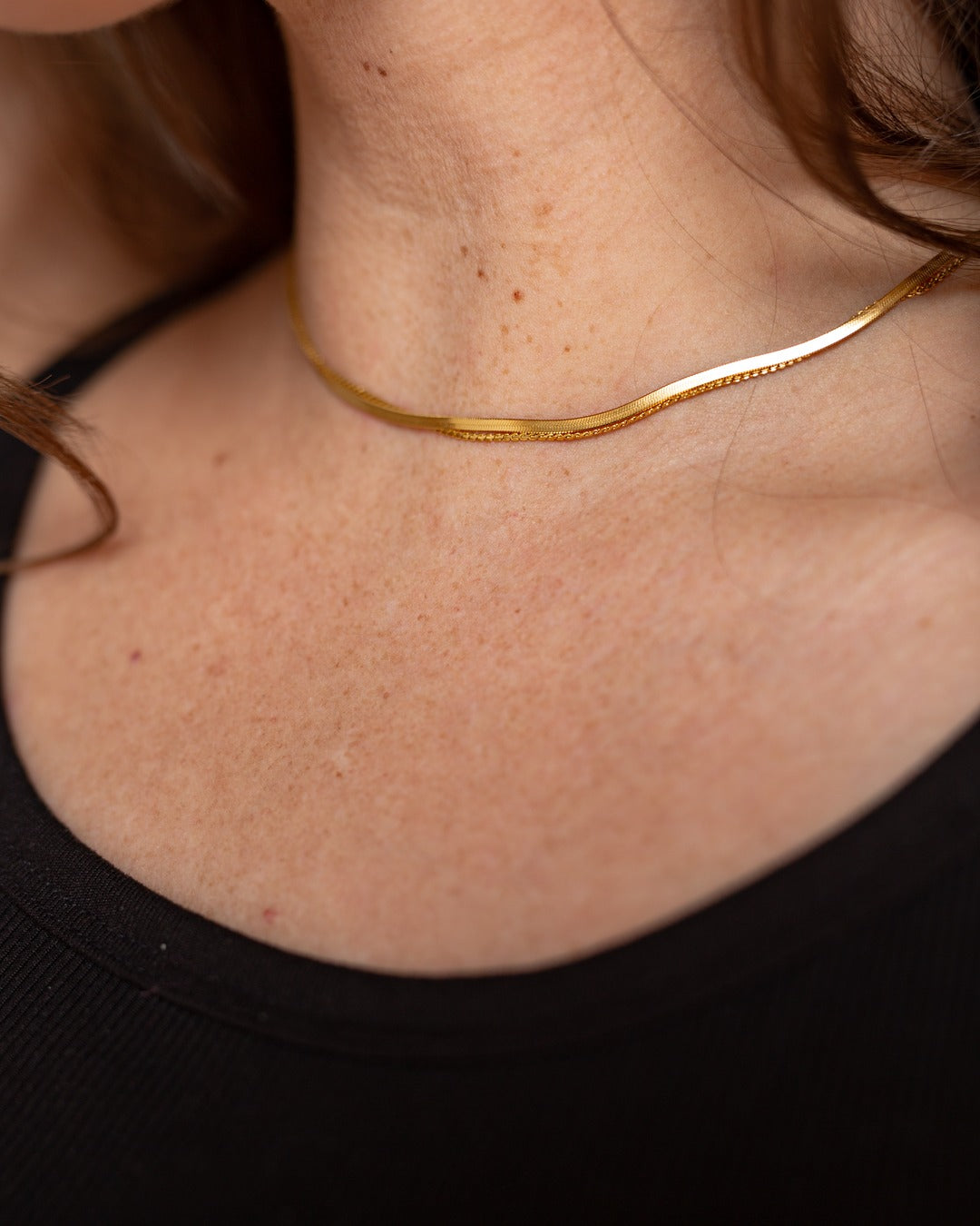 Demi Chain shown in a close styled neckline view.