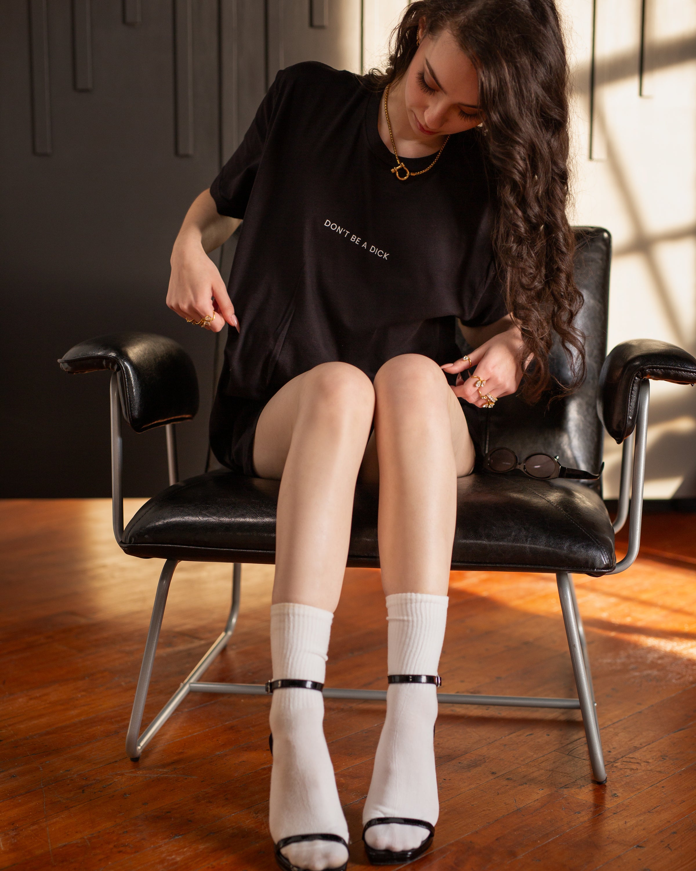 Additional fit view of the black DON’T BE A DICK T-shirt.