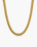 Wide polished gold-tone Elle herringbone chain necklace with a lobster clasp and adjustable extender chain.