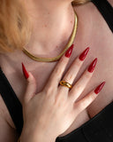 Elle Chain worn flat against the neckline, hover view.