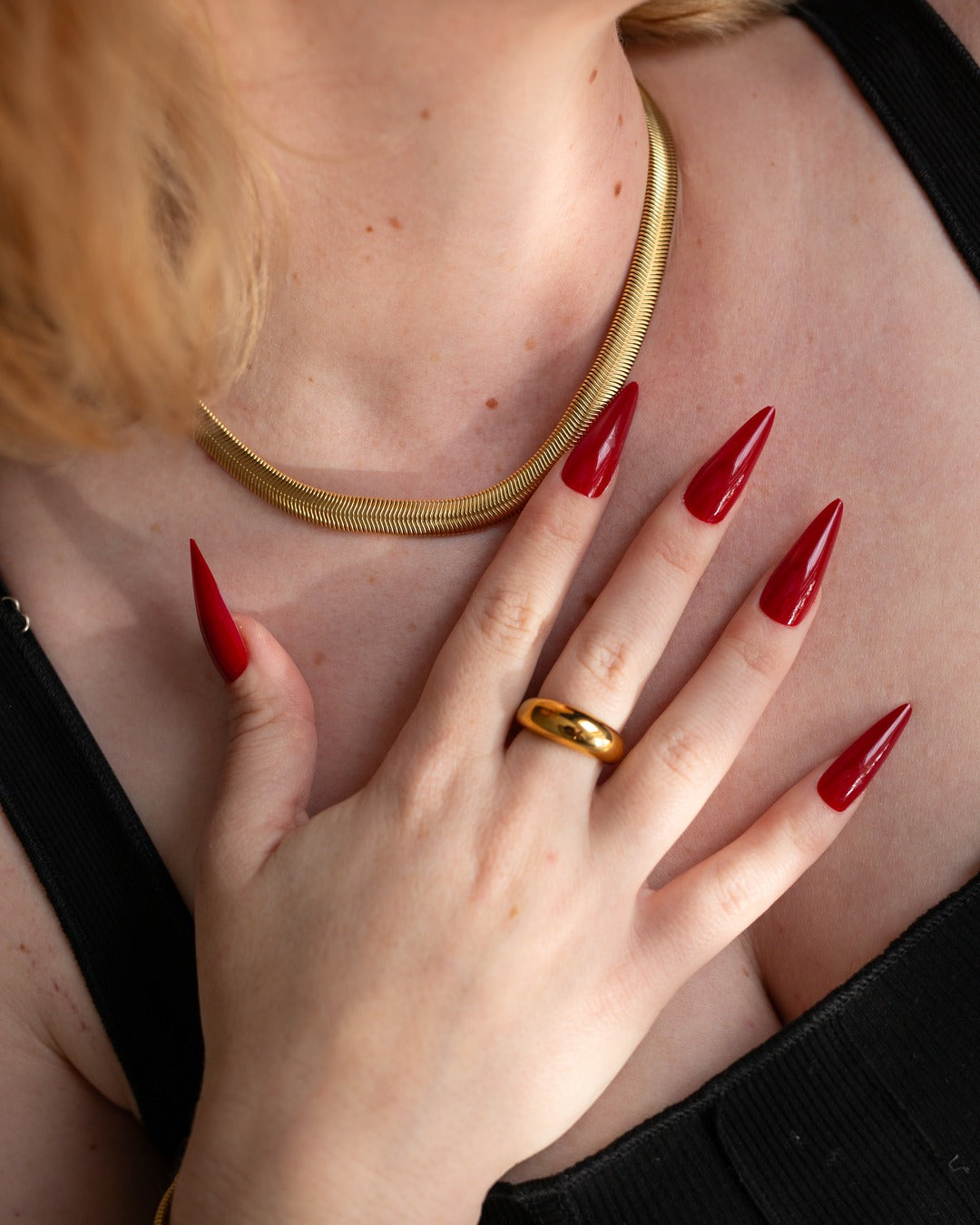 Elle Chain worn flat against the neckline, hover view.