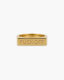 Polished gold-tone rectangular signet ring engraved with “FUCK OFF” on a white background.