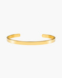 Gaia Cuff, a sleek flat 18K Gold PVD open cuff bracelet.