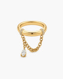 Gold-tone Gina statement ring with draped chains and a dangling pear-cut clear stone on a white background.