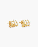 Pair of gold-tone triple-row ear cuff earrings with clear pavé stones.