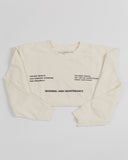 Cream High Maintenance crewneck sweatshirt worn by a model.