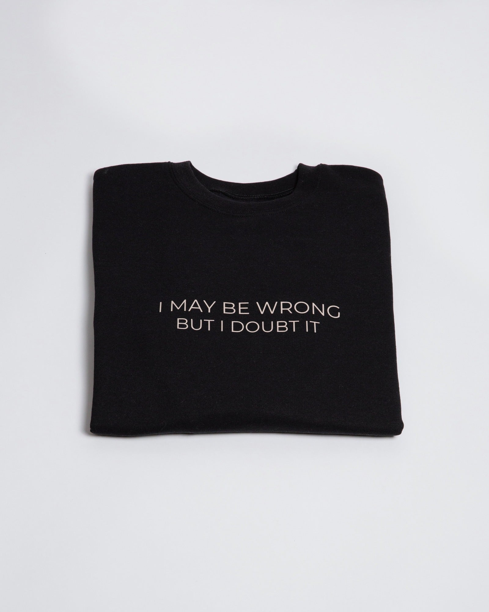 Folded black I May Be Wrong But I Doubt It crewneck sweatshirt.