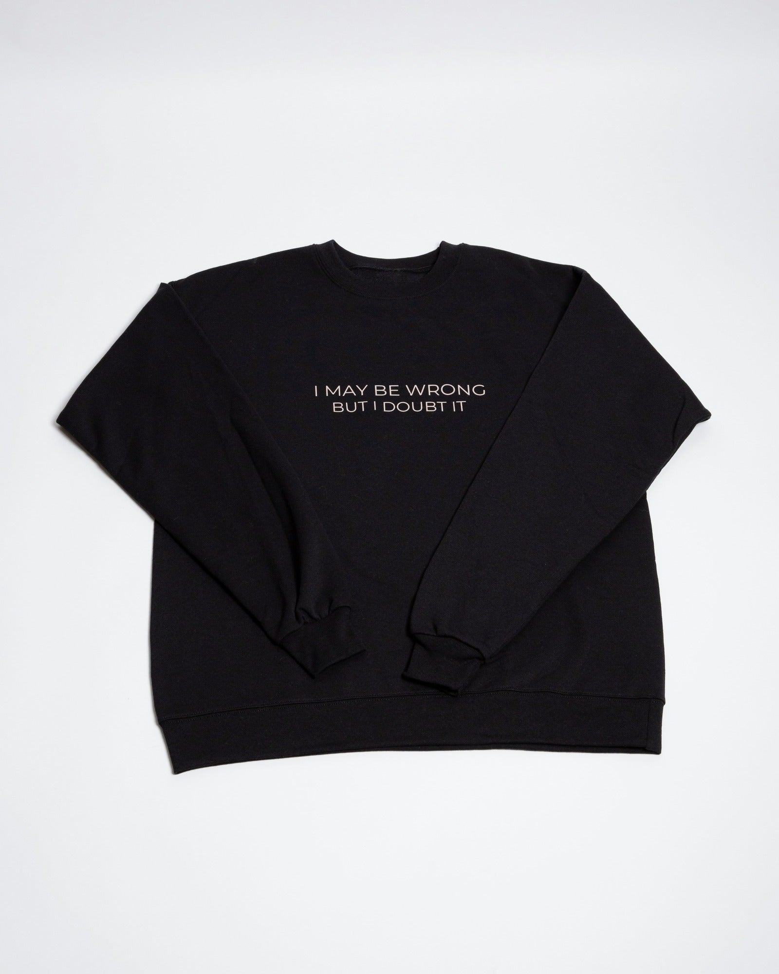 Black I May Be Wrong But I Doubt It crewneck sweatshirt laid flat.