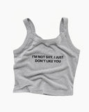 Heather-gray fitted camisole tank with thin straps and black text reading “I’M NOT SHY, I JUST DON’T LIKE YOU.”