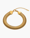 Isadora gold herringbone bracelet with clasp on a white background.
