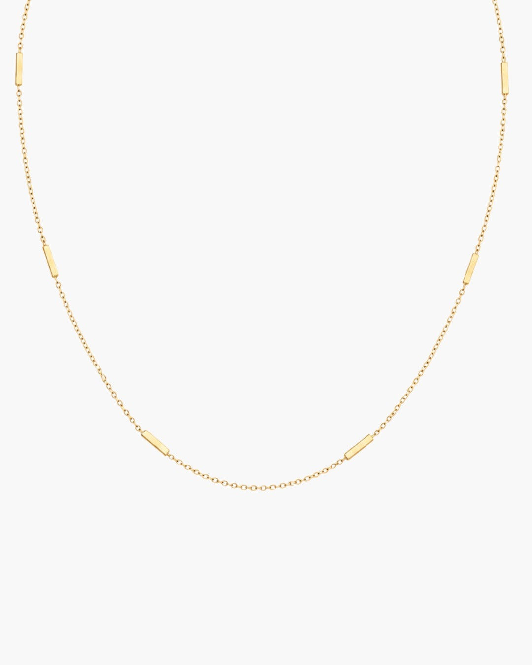Fine gold-tone Leda Chain necklace with evenly spaced slim rectangular bar stations, a lobster clasp and adjustable extender.