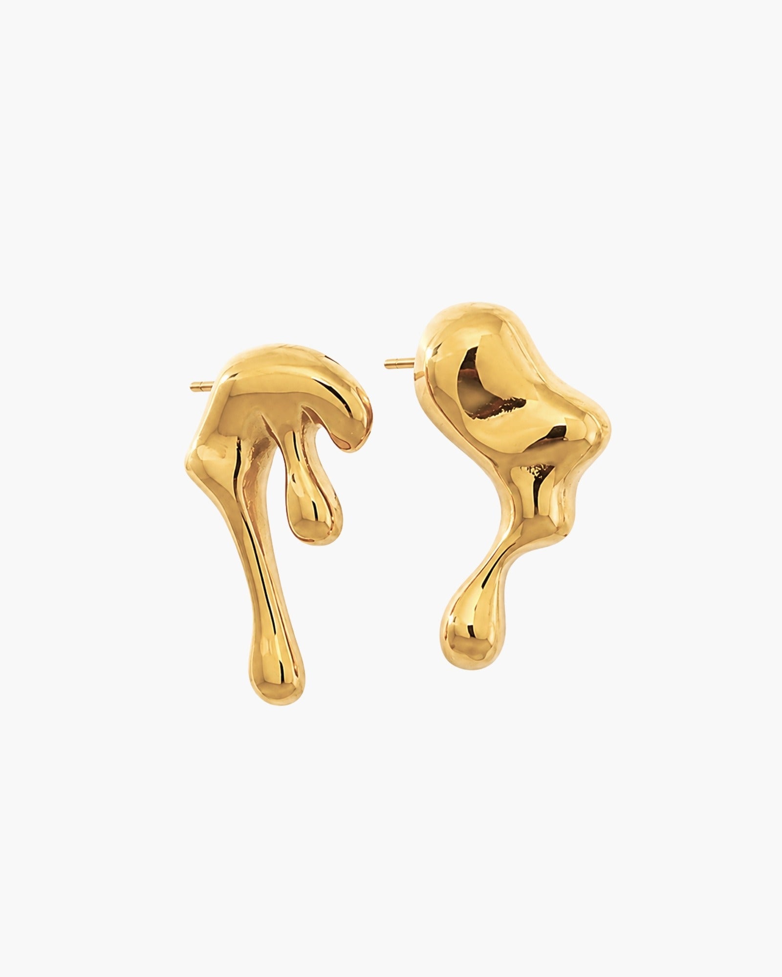 Pair of asymmetrical polished gold-tone statement earrings with sculptural molten shapes.