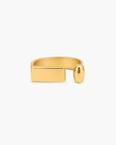 Polished gold-tone Lyra open ring with a wide rectangular end and a smooth rounded capsule-shaped end on a white background.