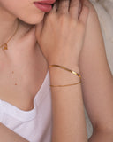 Lysa beaded bracelet styled with a gold cuff