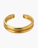 Madi Cuff, a bold 18K Gold PVD open cuff bracelet with a clean shape.