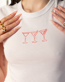 Lifestyle hover view of the white Martini Glasses baby tee.