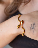 Medusa Cuff worn on the wrist, hover view.