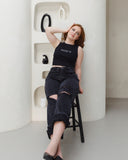Model wearing the black Moody AF tank with bold white front lettering.