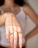 Morrigan Hand Chain worn across the wrist and hand, hover view.