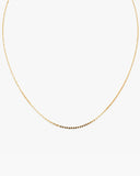 Fine gold-tone Muse Chain necklace with a lobster clasp and adjustable extender chain on a white background.