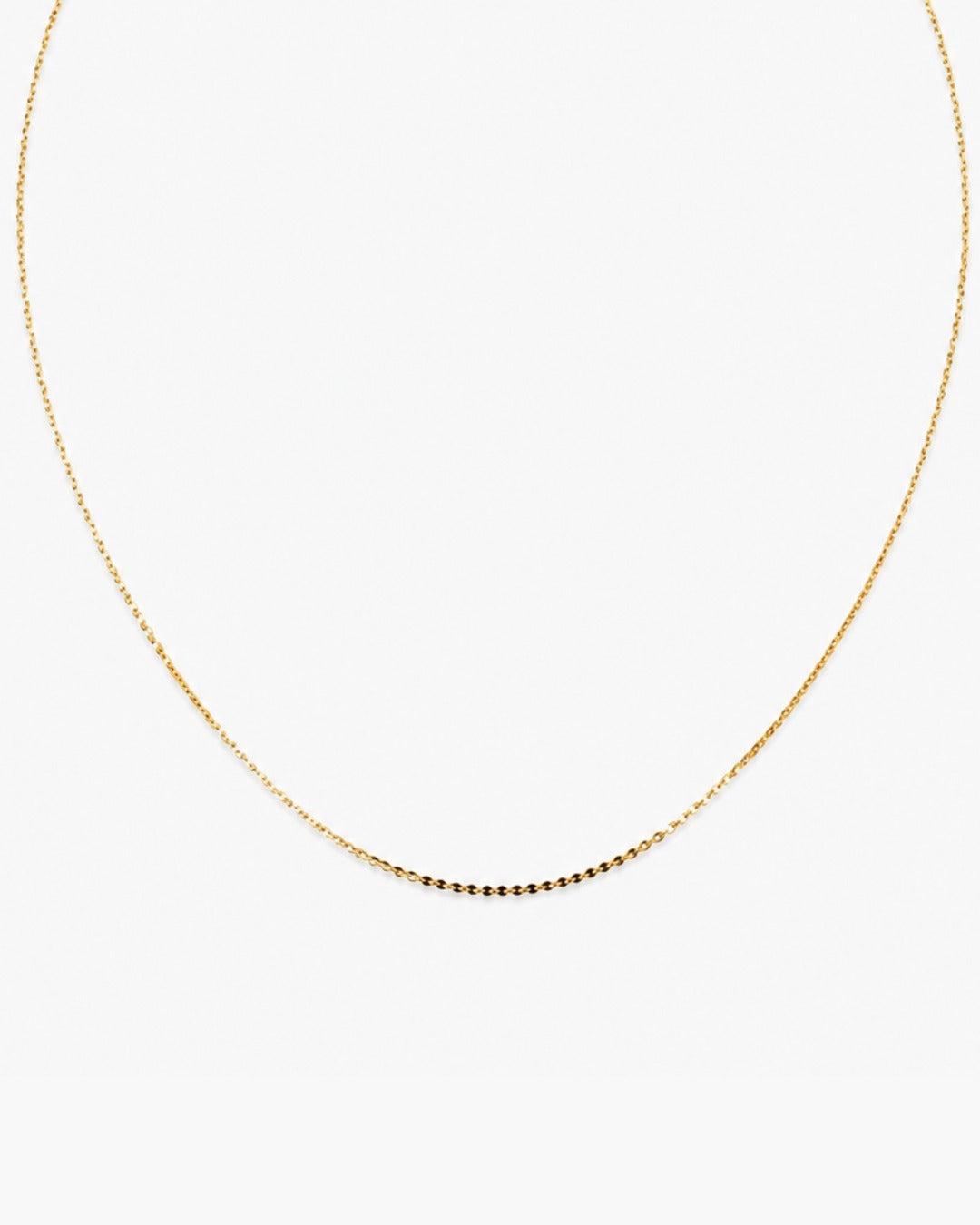 Fine gold-tone Muse Chain necklace with a lobster clasp and adjustable extender chain on a white background.