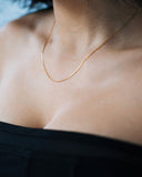 Muse Chain worn close against the neckline, hover view.