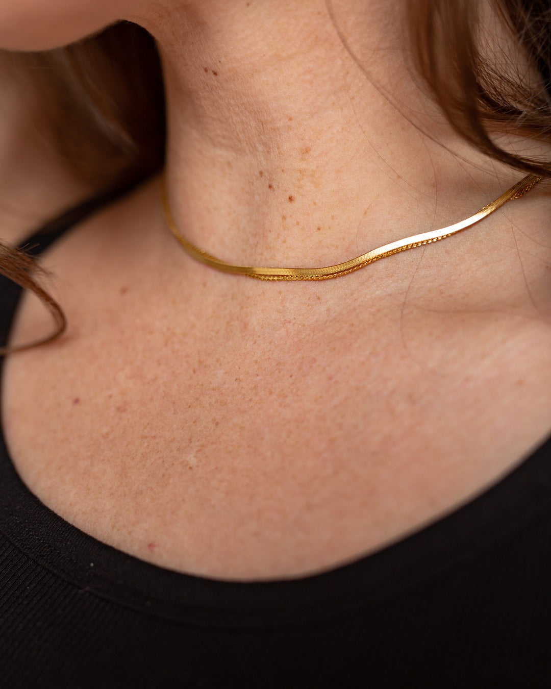 Muse Chain shown in a close styled neckline view.