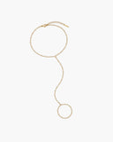 Nephele hand chain, a delicate gold-tone hand chain bracelet with an adjustable wrist chain, a fine connecting strand and a matching finger-ring loop.