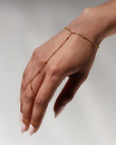 Nephele Hand Chain worn across the wrist and hand, hover view.