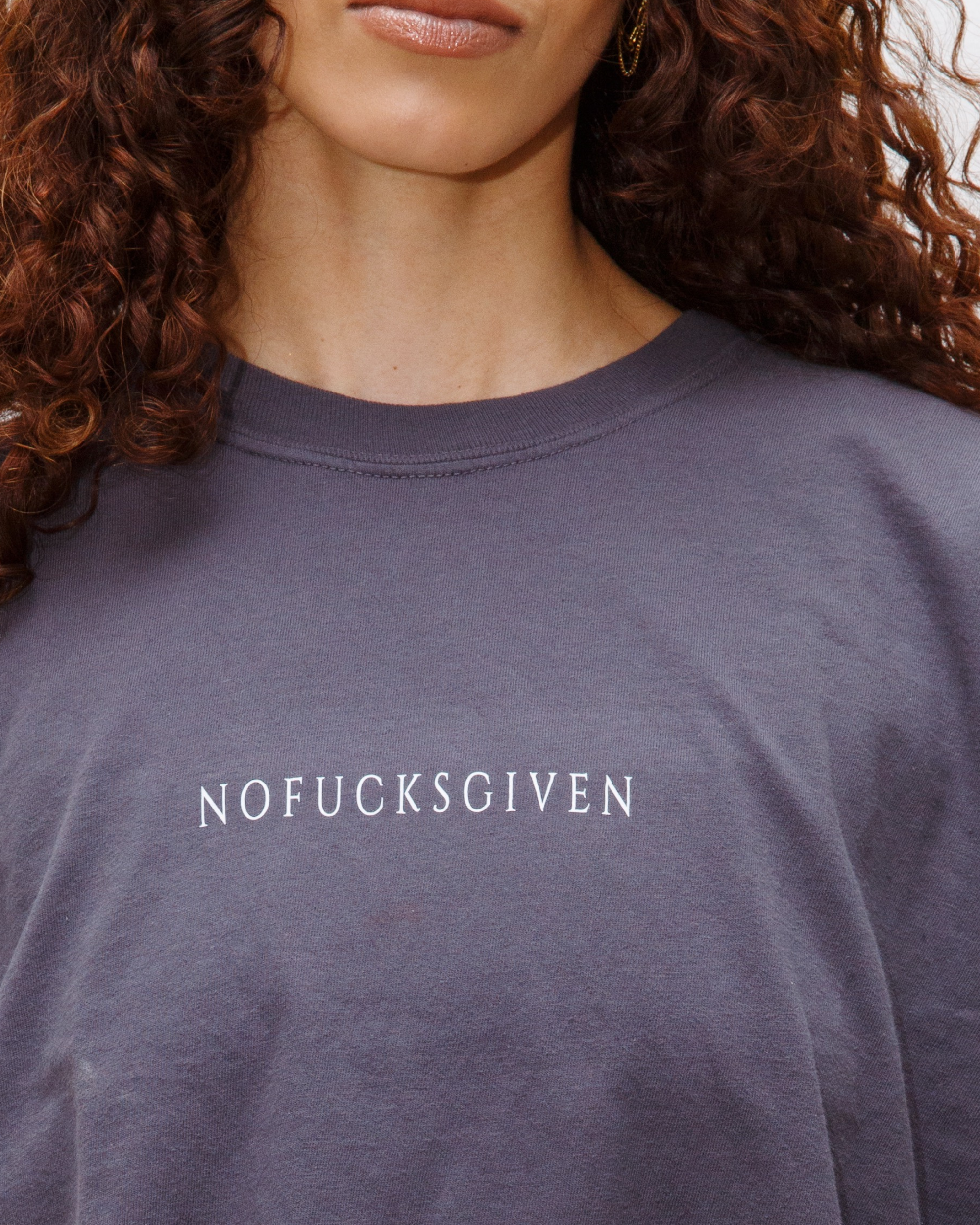 Washed granite crewneck T-shirt with small white NOFUCKSGIVEN text centered on the chest.