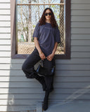 Lifestyle view of the washed granite NOFUCKSGIVEN T-shirt.