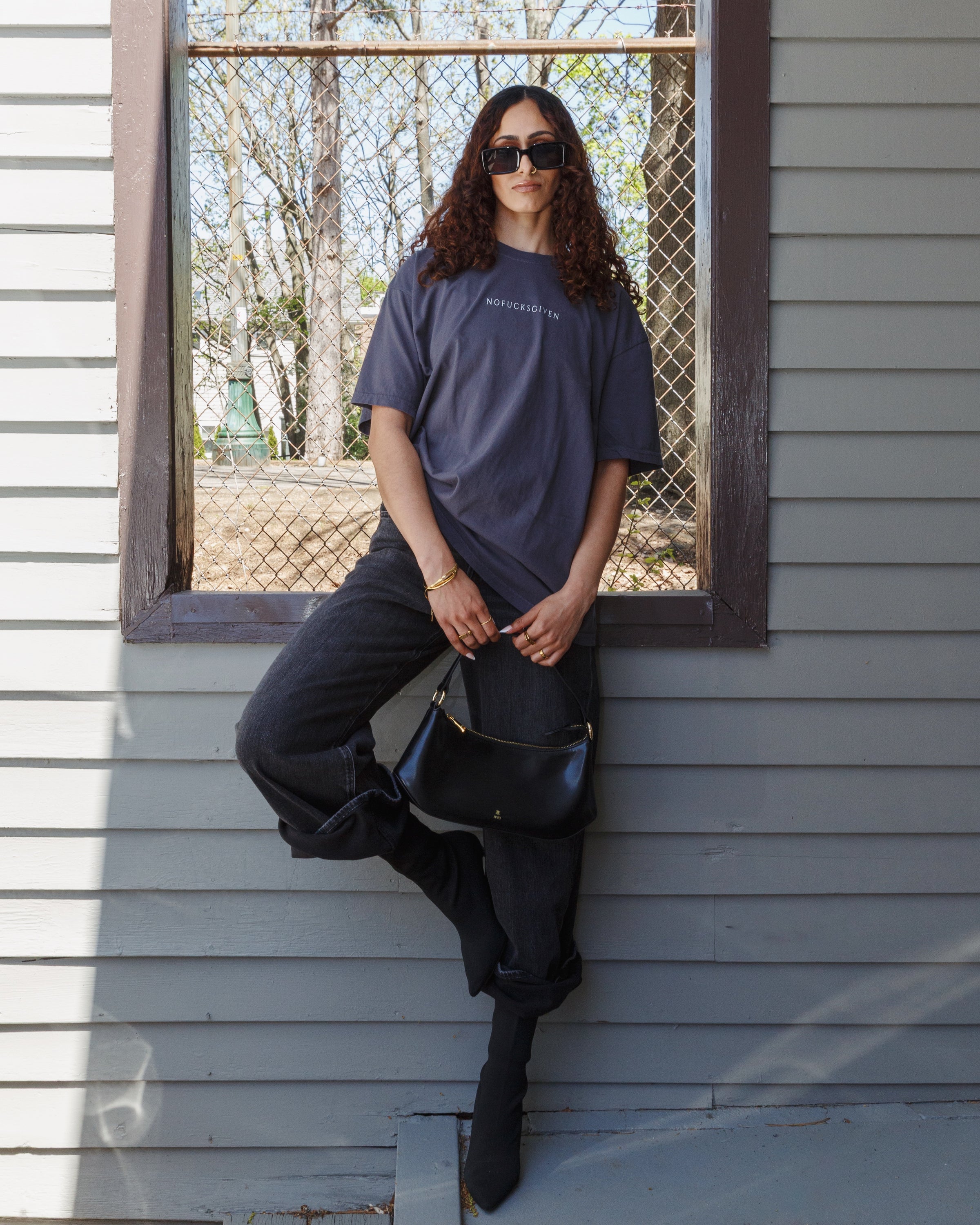 Lifestyle view of the washed granite NOFUCKSGIVEN T-shirt.
