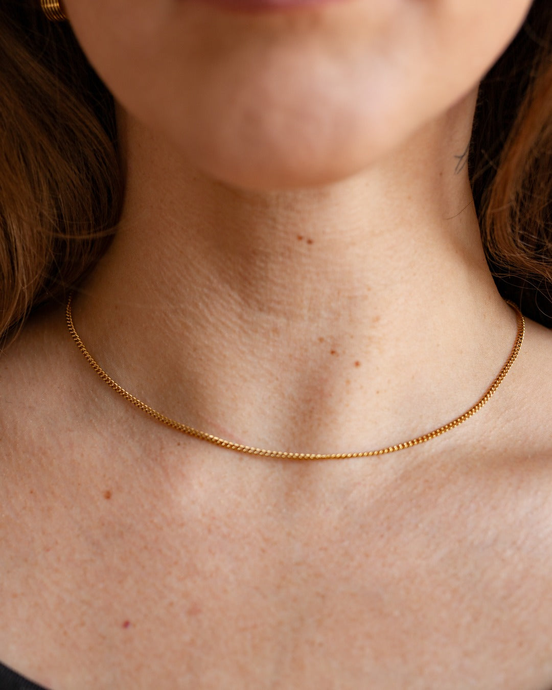 Nymph Chain shown in a close styled neckline view.
