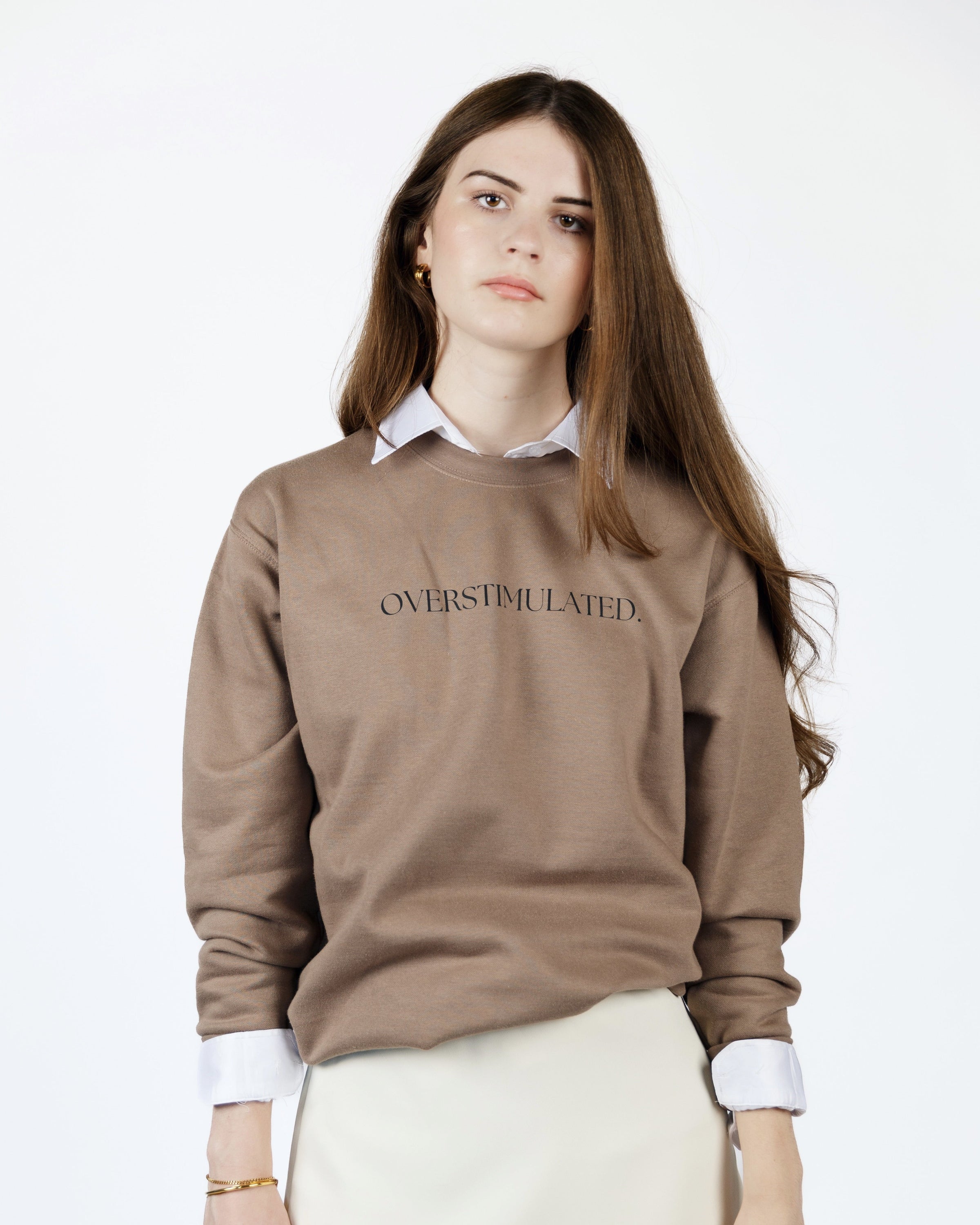 Detail view of the warm brown Overstimulated crewneck sweatshirt.