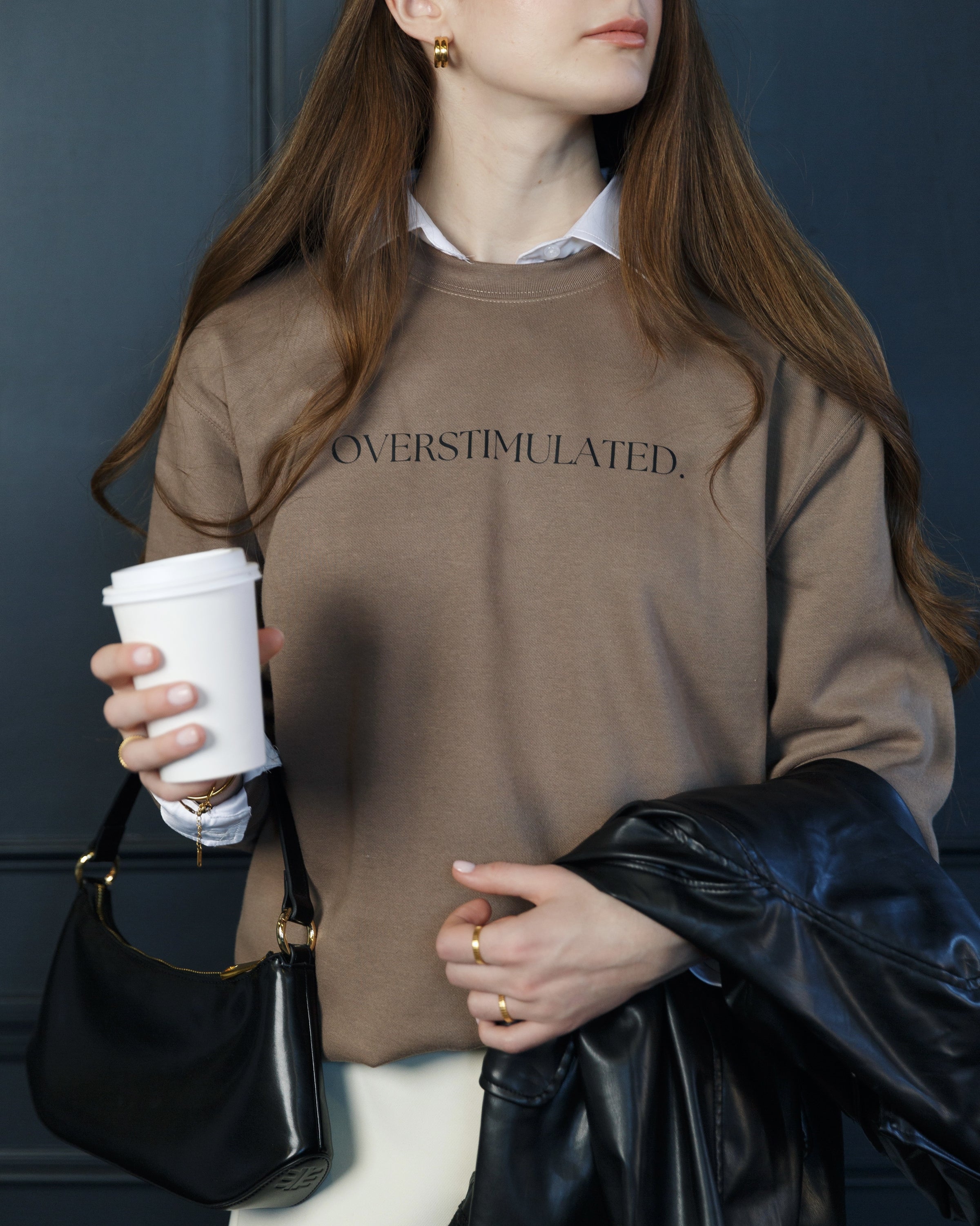 Warm brown Overstimulated crewneck sweatshirt worn by a model.